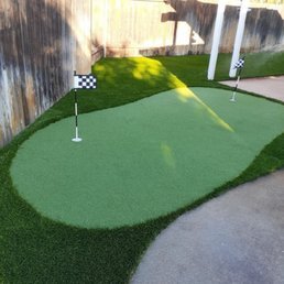 Backyard putting green with flag
