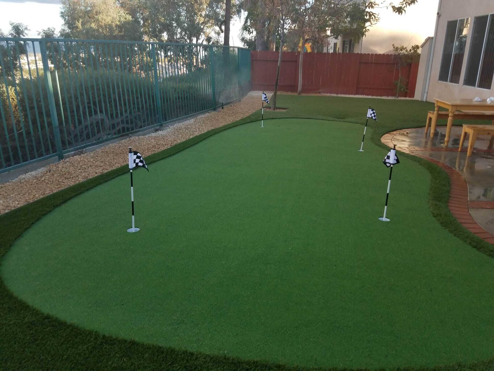 Landscaped lawn with lamp post and curved walkway