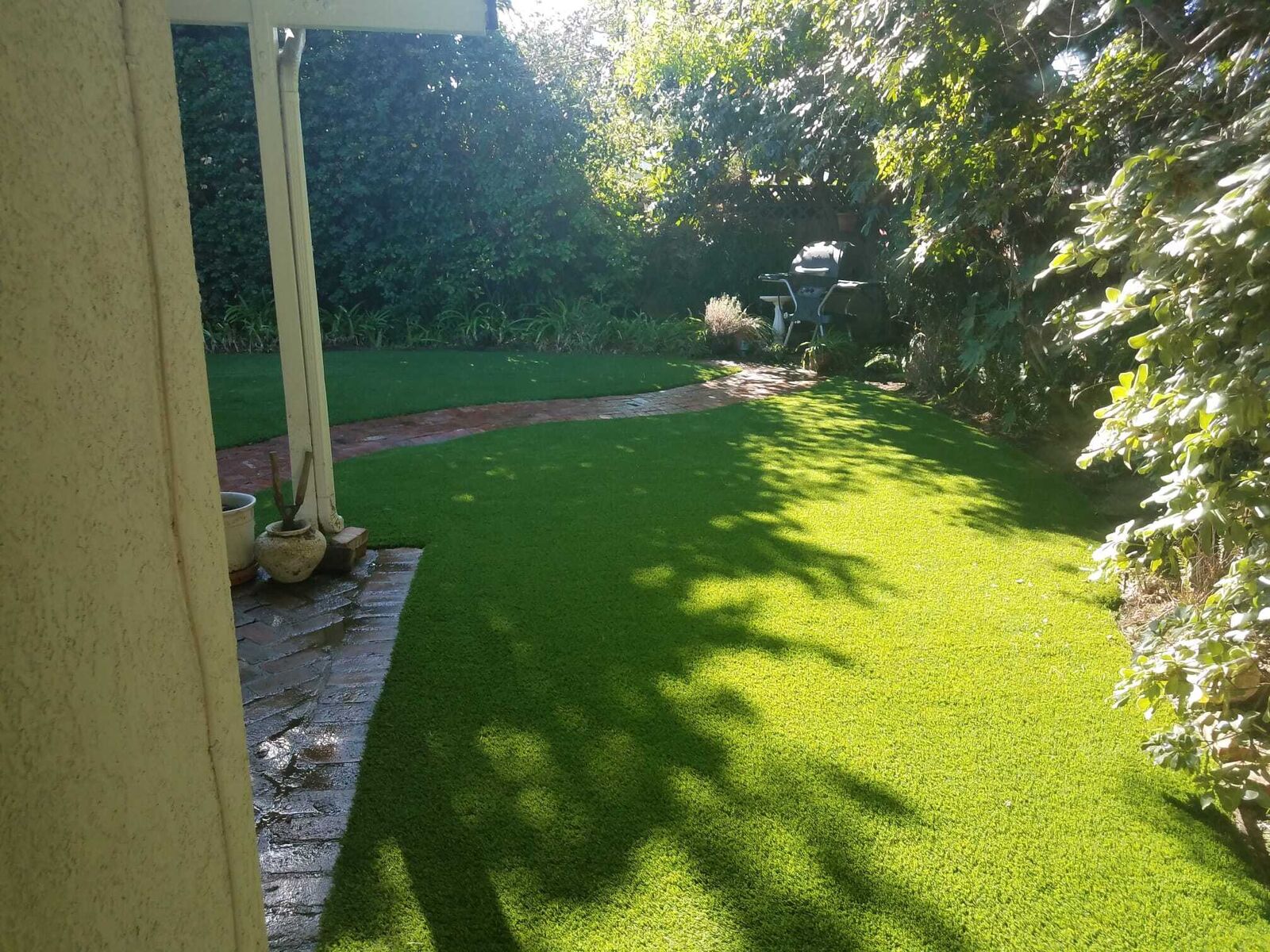 Turf installation alongside a covered patio